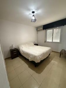 Ένα ή περισσότερα κρεβάτια σε δωμάτιο στο Apartamento Pueyrredon