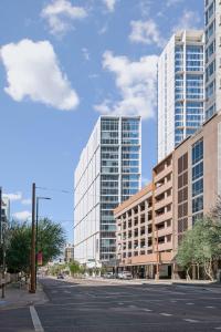 an empty city street with two tall buildings at Placemakr Downtown Phoenix in Phoenix