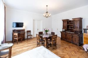 a living room with a table and chairs and a desk at Grünes Haus in Murau