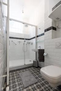 a bathroom with a shower and a toilet and a sink at Grünes Haus in Murau +42 photos