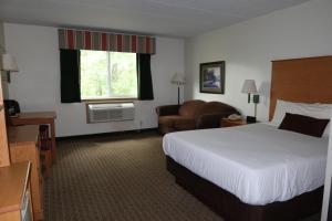 Ένα ή περισσότερα κρεβάτια σε δωμάτιο στο Americas Best Value Inn +17 φωτογραφίες