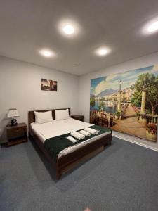 Кровать или кровати в номере Cozy Inn Nizami street +34 фотографии