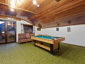 a room with a pool table in a house at Landhaus Herz der Tauern in Mallnitz