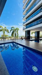 a large swimming pool in front of a building at landscap Meireles Fortaleza in Fortaleza
