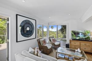 a living room with a couch and a table at Paraiso Del Mar - by Coast Hosting in Copacabana
