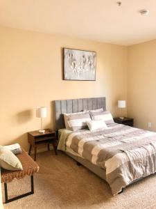 a bedroom with a large bed and two night stands at Spacious 2B 2B Pool View Loft Apartment in Marina Del Rey in Los Angeles