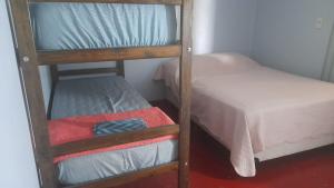 a couple of bunk beds in a room at Duplex En Iguazu in Puerto Iguazú +2 photos