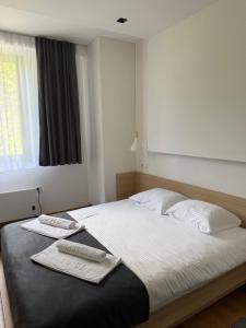 Ένα ή περισσότερα κρεβάτια σε δωμάτιο στο Reset Jahorina