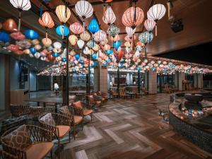 a restaurant with many lights hanging from the ceiling at Kinugawa Hotel Mikazuki in Nikko