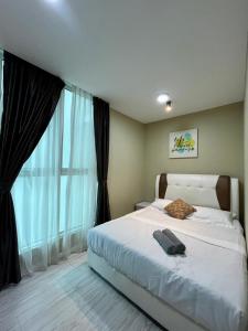 Ένα ή περισσότερα κρεβάτια σε δωμάτιο στο SUTERA AVENUE T2 2BEDROOM by GC near imago kk +30 φωτογραφίες