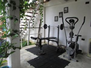 a gym with exercise equipment in a building at Jumanji in Palomino