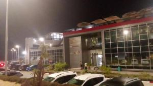 a parking lot in front of a building at night at Rayad Ajdir alhociema in Ajdir +7 photos