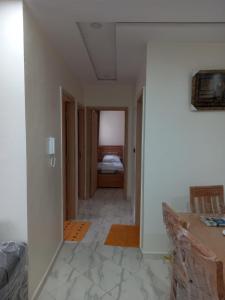 a room with a hallway with a bed in a room at Rayad Ajdir alhociema in Ajdir