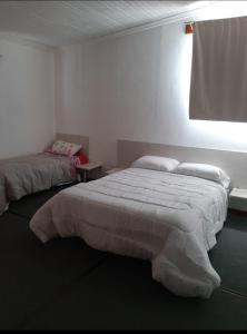 Ένα ή περισσότερα κρεβάτια σε δωμάτιο στο Petit departamento céntrico +10 φωτογραφίες