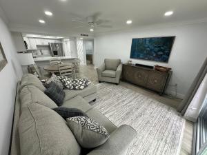 a living room with a couch and a table at 2 BR Condo in St Augustine across from Beach in Saint Augustine