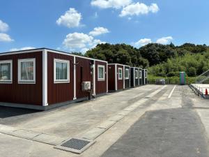 a row of mobile homes in a parking lot at SMA MO inn Omitama in Omitama +35 photos