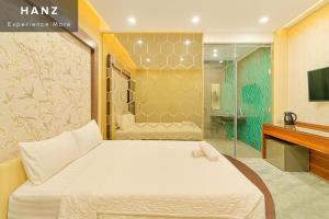 a bedroom with a bed and a shower at S79 Hotel T68 in Ho Chi Minh City