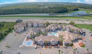 an aerial view of a resort with a parking lot at Whimsical Condo 1.5M from Disney in Orlando