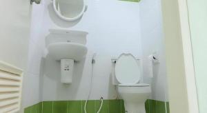 a bathroom with a white toilet and a mirror at Chevasai Huahin Hotel in Hua Hin +91 photos