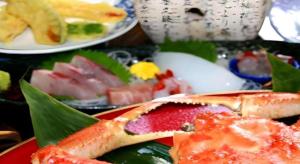 a plate of food on a table with sushi at Otaiko Hills in Fukui