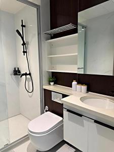 a bathroom with a toilet and a sink and a shower at Bay Suites Likas - 沙巴民宿 - 3 Min to KK City - Sea View 21-19 in Kota Kinabalu