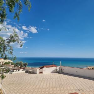 a view of the ocean from a building at Villa Eden in Porto Empedocle +26 photos