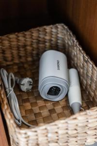 a basket with a camera and other items in it at Anna Villa Pererenan in Canggu