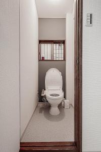 a bathroom with a white toilet in a room at 勝清居 大阪獨棟車庫民宿 千日前線新深江站2分一線直達 難波日本橋 全新裝修3LDk in Osaka +24 photos