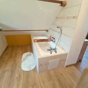 a small bathroom with a sink and a toilet at Chez Eric et Nath in Bois-Herpin +21 photos