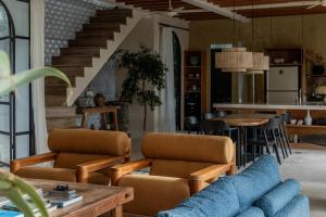 a living room with a couch and a table at BI Design House Canggu in Canggu