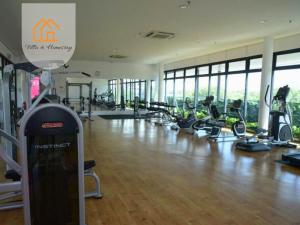 a gym with a lot of treadmills and ellipticals at KANVAS SOHO Cyberjaya Haven - 1BR - WiFi in Cyberjaya