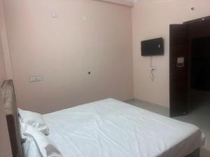 En eller flere senge i et værelse på MOON STAR HOTEl