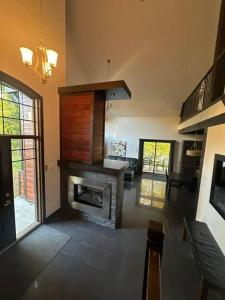 a living room with a fireplace in a house at Nature & confort - Refuge L'Equilibre in Scott