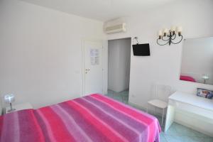 Voodi või voodid majutusasutuse Albergo Dei 10 Colori toas