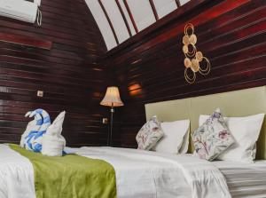 Ένα ή περισσότερα κρεβάτια σε δωμάτιο στο Bellewood Villa