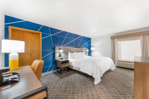 a hotel room with a bed and a desk at Comfort Inn - Killeen near Fort Cavazos in Killeen +24 photos