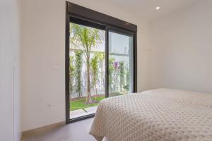 Postel nebo postele na pokoji v ubytování Villa Feliz