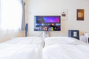 Postel nebo postele na pokoji v ubytování Sky Garden