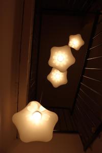 a group of lights on a wall in a room at fuga romantica in Benisuera +13 photos