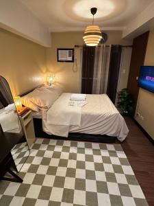 Postel nebo postele na pokoji v ubytování La Verti Residences Pasay City