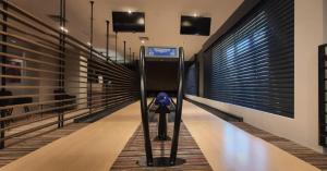 a bowling alley with a camera in the middle at Radocza Park Active & Spa in Radocza