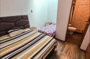 Ένα ή περισσότερα κρεβάτια σε δωμάτιο στο Casa en Ica con Piscina cerca a la Huacachina