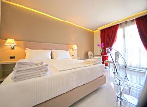 Postel nebo postele na pokoji v ubytování Hotel Palace + 37 fotografií