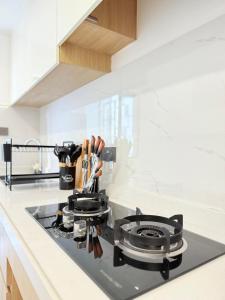 a kitchen counter with a stove top in a kitchen at luxury living two bedroom apartment with swimming pool children playing ground area ample parking space and amazing scenic views in lavington in Nairobi
