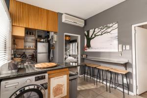 a kitchen with a sink and a dishwasher at Avemore Eikehoff No 26 full power back up in Stellenbosch +13 photos