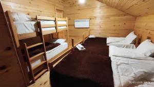 a room with two bunk beds in a cabin at Gaul Gavkhe Hotel in Khalde