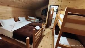 a bedroom with two bunk beds in a cabin at Gaul Gavkhe Hotel in Khalde