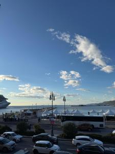 a parking lot with a cruise ship in the water at Pep's Rooms by the sea in Trieste