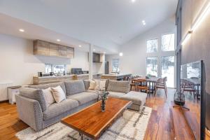 a living room with a couch and a table at 翠葉 Rusutsu in Rusutsu +107 photos