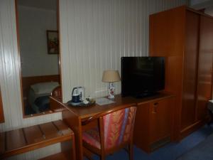 TV a/nebo společenská místnost v ubytování Hotel 'T Hert